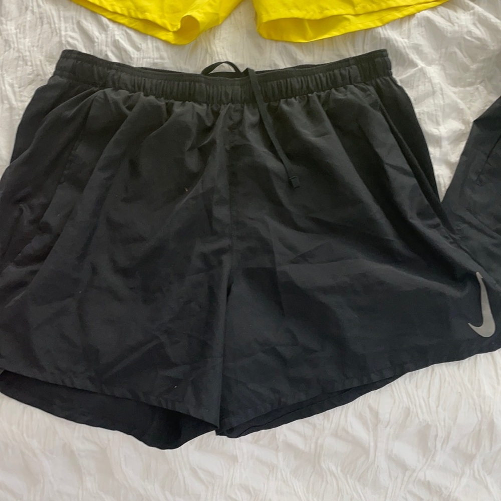 Used only 1-2 times each, these men’s running Nike shorts with pockets. No flaws